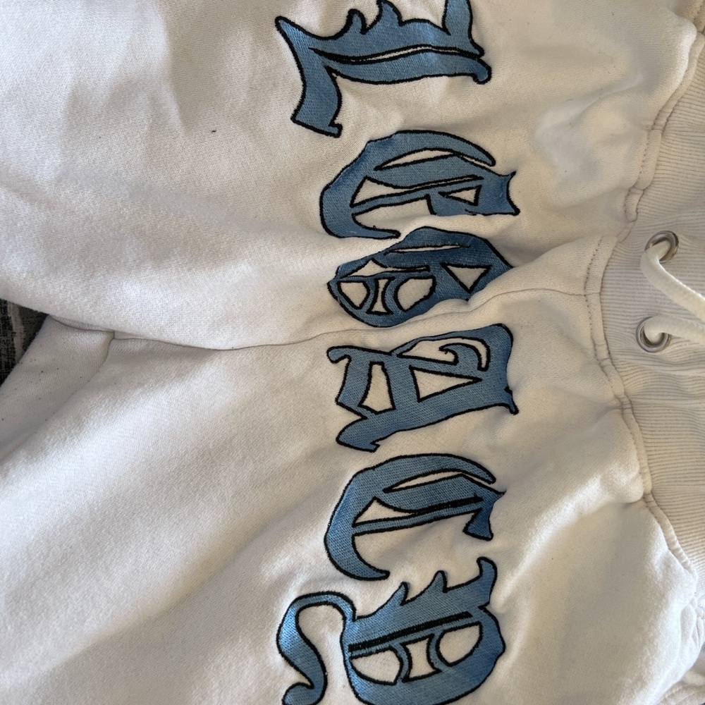 White Sweatpants with Blue Lettering